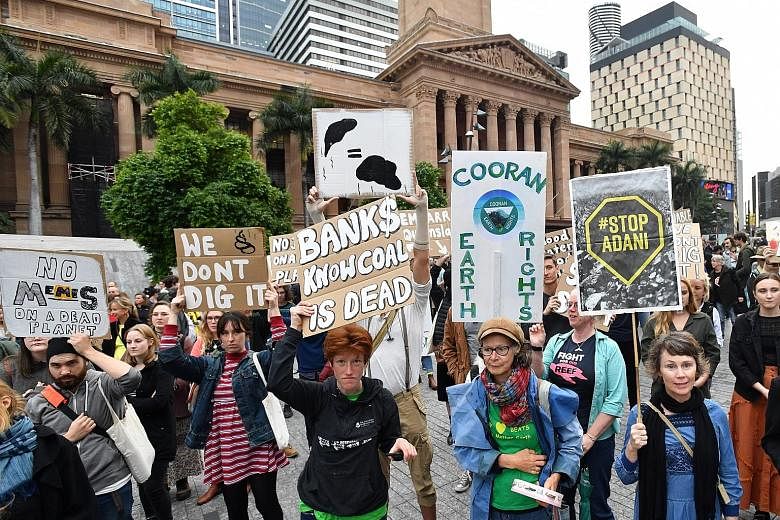 Protesters against the coal mine project in Brisbane's King George Square last Friday. Indian mining giant Adani Group has been seeking for almost a decade to develop the estimated A$4 billion (S$3.8 billion) mine in Queensland, but the project has b