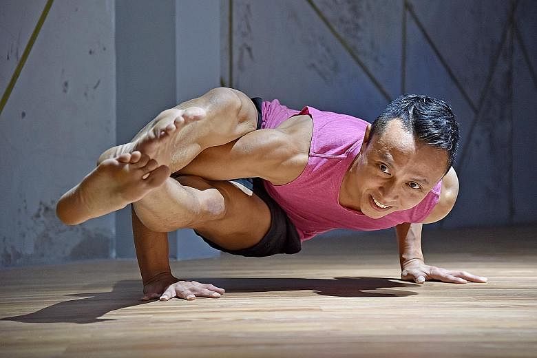 Yoga instructor Derris Chew doing an eight-angle pose.