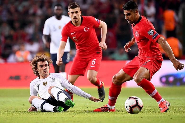 France forward Antoine Griezmann is easily shackled by Turkey defender Zeki Celik during their Euro 2020 qualifier in Konya. The hosts beat the world champions 2-0 to lead Group H by three points.