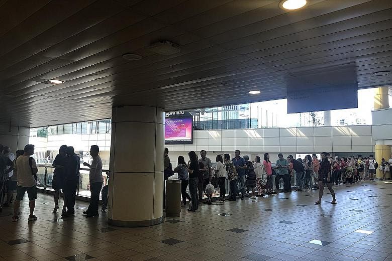 Each person is allowed to exchange for up to 20 pieces of the new $20 note in each transaction. Long queues were seen at many bank branches across the island, including the OCBC branch in Toa Payoh Central (above), from early yesterday morning.