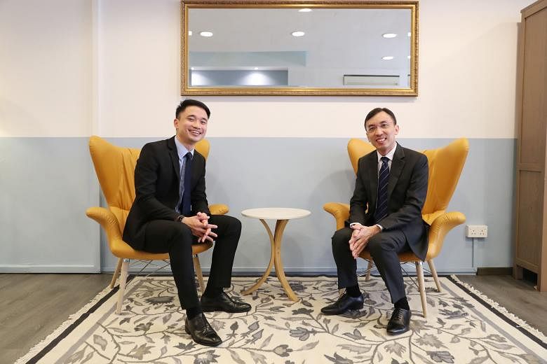 Providend chief executive Christopher Tan (right) says flexi-work options help the firm retain talent such as client adviser Loh Yong Cheng (left), who works from home twice a month to look after his daughter.
