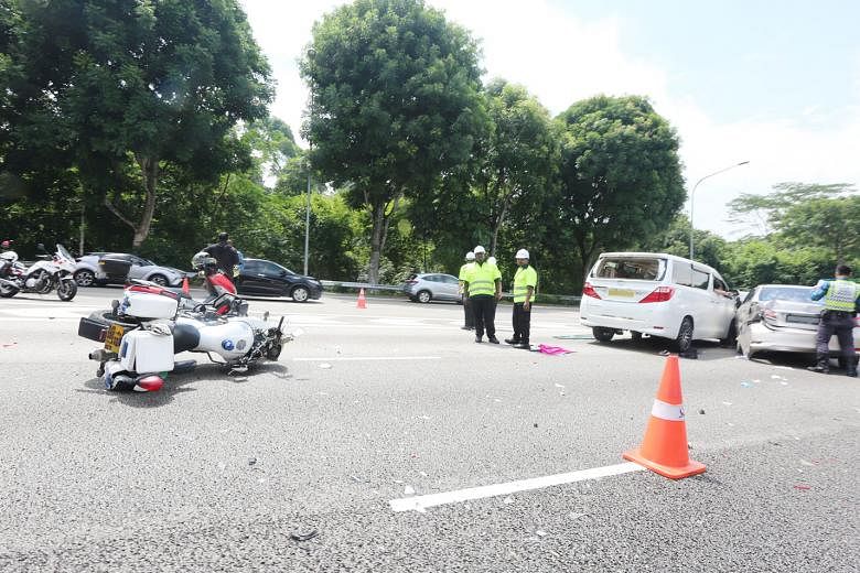 The site of the accident on Sunday, where a car skidded and hit a Traffic Police officer and an SCDF paramedic, who were attending to earlier accidents along the Pan-Island Expressway. PHOTO: SHIN MIN DAILY NEWS