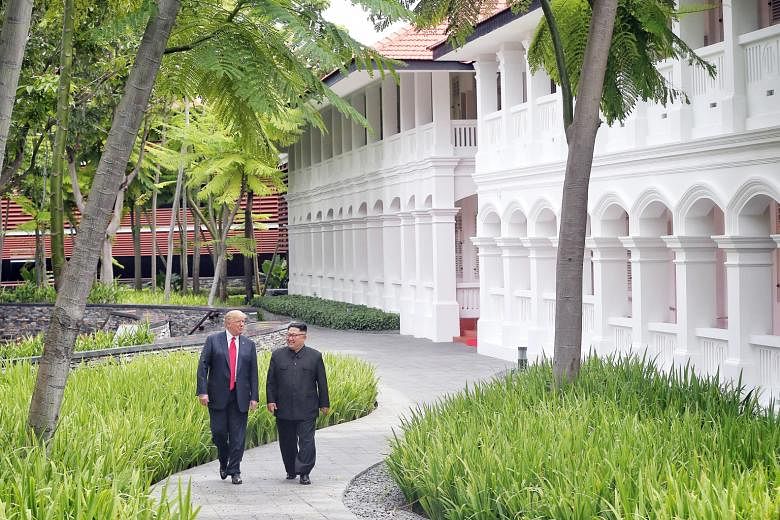 US President Donald Trump and North Korean leader Kim Jong Un at the Capella Hotel on Sentosa last year. A memorial plaque was to be unveiled today at the hotel, but the North Korean embassy has postponed the event.
