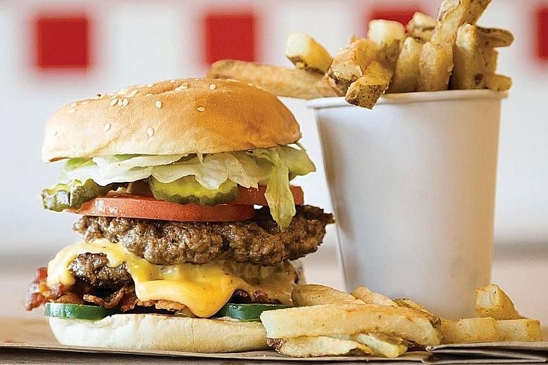 Five Guys is known for its customisable beef burgers (above), hotdogs, milkshakes and sandwiches. Zouk Group is bringing in the franchise and chief executive officer Andrew Li says there will be more than one outlet here.