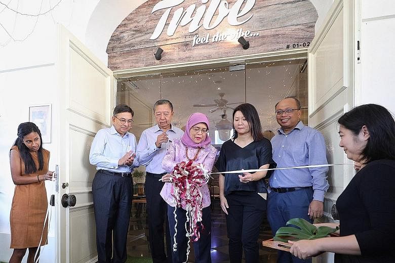 President Halimah Yacob with (from far left) Singapore Centre for Social Enterprise (raiSE) chairman Gautam Banerjee, PCSEA committee chairman Tan Soo Nan, Bliss Group founder Christine Low, and raiSE chief executive Alfie Othman at the official open
