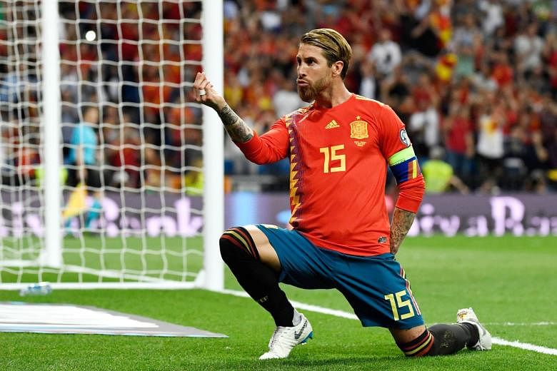Spain's Sergio Ramos celebrates after scoring the opening goal against Sweden from the spot in their 3-0 Euro 2020 qualifying win at the Santiago Bernabeu in Madrid. The three-time champions lead Group F by five points.