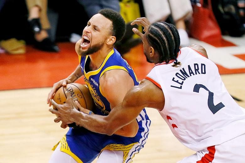 Stephen Curry, challenged by Kawhi Leonard as he drives to the basket, scored a game-high 31 points in Golden State's 106-105 defeat of Toronto in Game 5 of the NBA Finals on Monday. Below: The Warriors' efforts in narrowing their series deficit to 3