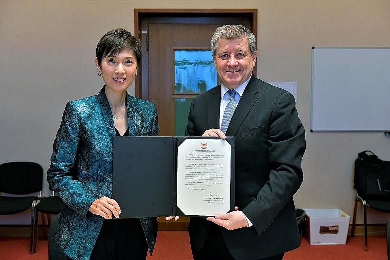 Manpower Minister Josephine Teo and International Labour Organisation director-general Guy Ryder with the instrument of ratification for the ILO's Occupational Safety and Health Convention. Singapore is the second Asean country after Vietnam to endor