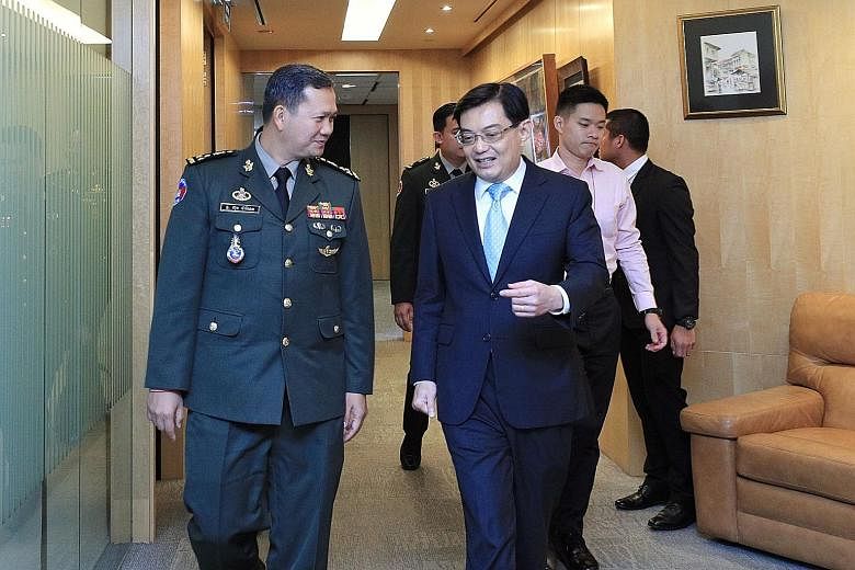 Deputy Prime Minister Heng Swee Keat with Lieutenant-General Hun Manet, commander of the Army of the Royal Cambodian Armed Forces yesterday. PHOTO: HENG SWEE KEAT/ FACEBOOK