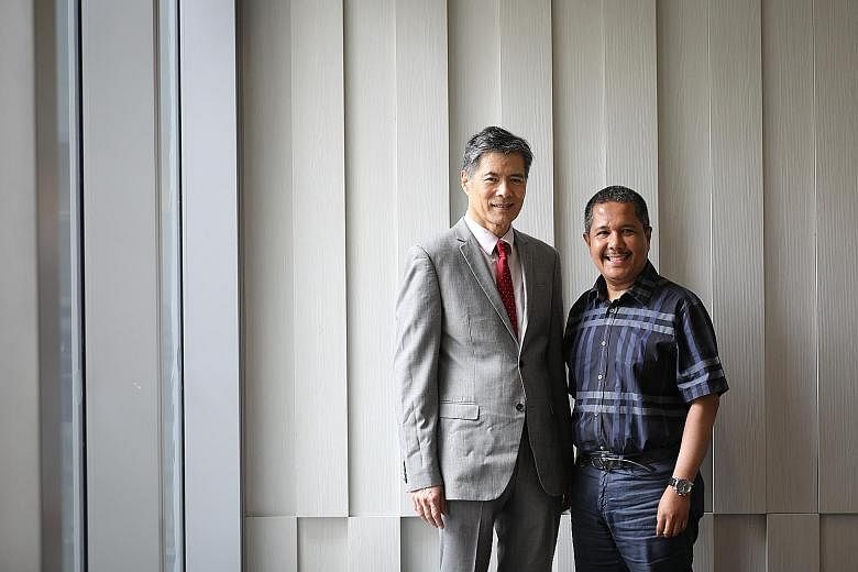 Professor Lim Seng Gee with Mr Arfan Awaloeddin, who has been functionally cured of hepatitis B under a new study led by Prof Lim. ST PHOTO: ONG WEE JIN