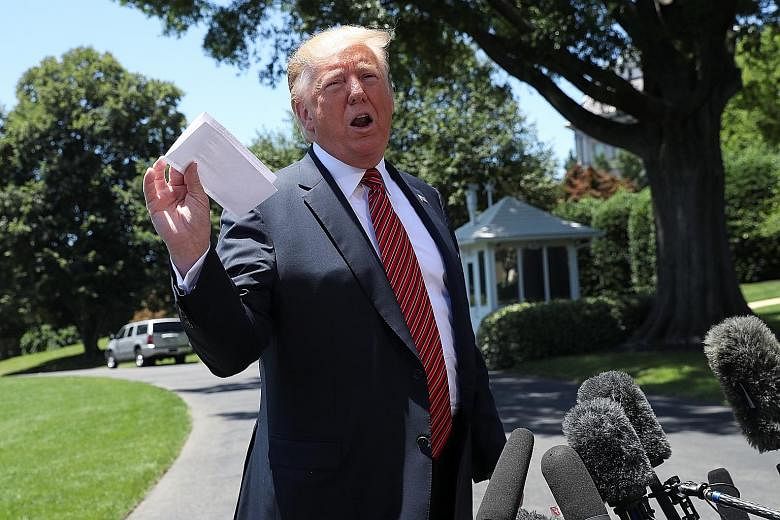 US President Donald Trump with what he said was a letter from North Korean leader Kim Jong Un on Tuesday. Despite widespread perception that their Hanoi summit was a failure, Mr Trump said he would be open to a third meeting with Mr Kim.