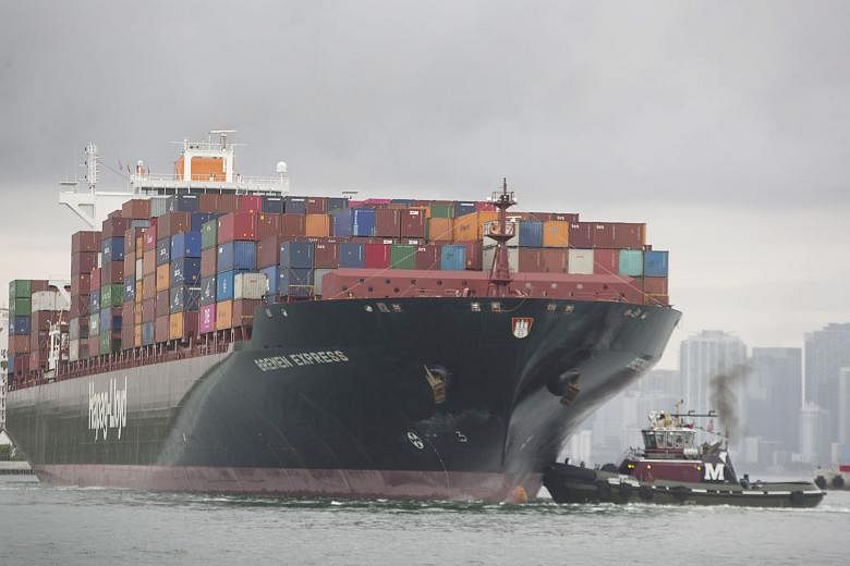 A container ship at PortMiami, Florida. The US and China are locked in a trade war that has hurt global growth.