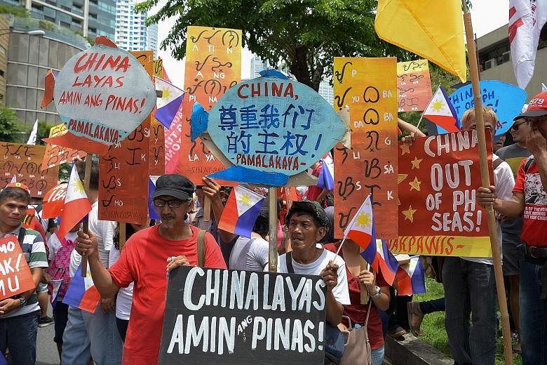 Activists in Manila protesting against China, as tensions rise over Beijing's presence in the disputed South China Sea. PHOTO: AGENCE FRANCE-PRESSE