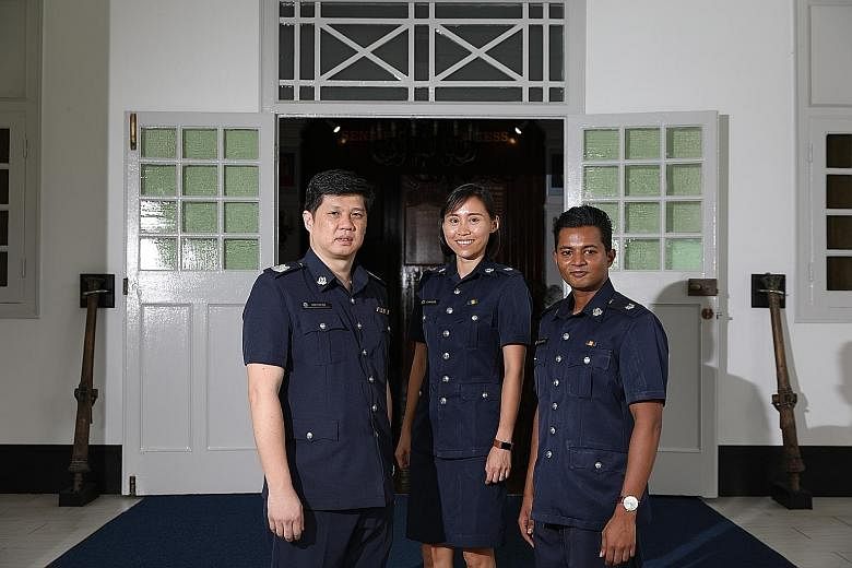The officers who received awards yesterday included Staff Sergeant Mohamad Khairul Aidil Mohd (above) and E-commerce Fraud Enforcement and Coordination Team members (at left) Senior Staff Sergeant Eric Low Hin Kee, ASP Clara Wong Bo Yin and ASP Esh J
