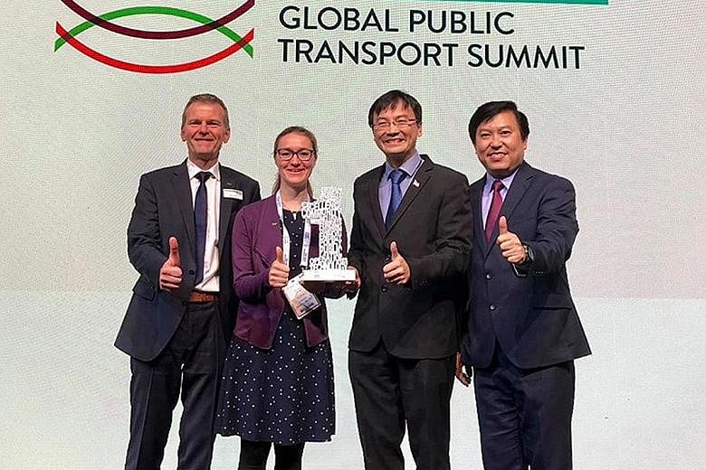 Land Transport Authority chief executive Ngien Hoon Ping (second from right) and deputy chief executive for policy and planning Jeremy Yap receiving the prize in the Diversity and Inclusion category together with Mr Klaus Janke, managing director of 