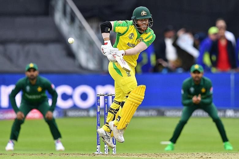 David Warner playing a shot en route to a 107-run feat during Australia's 41-run win over Pakistan in the Cricket World Cup at The County Ground in Taunton on Wednesday. PHOTO: AGENCE FRANCE-PRESSE