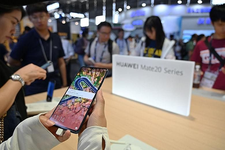 China's Huawei - the world's biggest maker of telecoms network gear - has filed to trademark its Hongmeng operating system in countries such as Cambodia, Canada, South Korea, Peru and New Zealand. PHOTO: AGENCE FRANCE-PRESSE