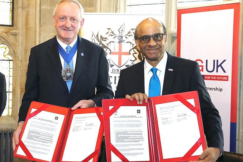 City of London Lord Mayor Peter Estlin and Senior Minister Tharman Shanmugaratnam, after signing a memorandum of understanding between the Monetary Authority of Singapore and the City of London Corporation.