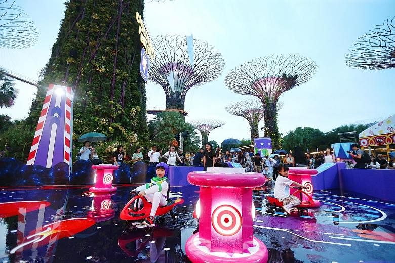 Children playing the "Star Adventurer" game at Gardens by the Bay, where this year's Children's Festival features a Toy Story 4 theme. PHOTO: LIANHE ZAOBAO
