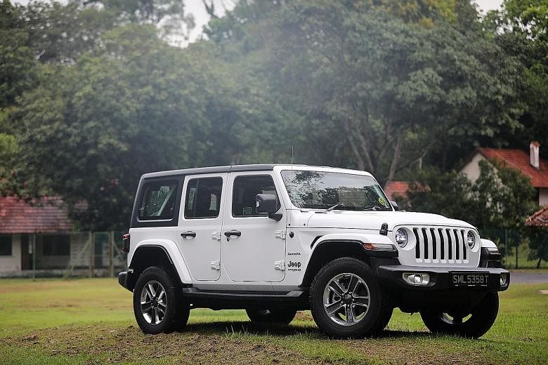 The Jeep Wrangler comes with detachable doors and roof and its windscreen can be flipped down, giving the five-seater a topless, sideless stance.