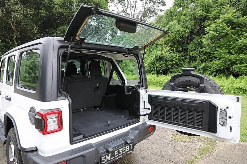 The Jeep Wrangler comes with detachable doors and roof and its windscreen can be flipped down, giving the five-seater a topless, sideless stance.