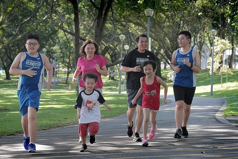 Mr Danny Ong and Ms Christine Chew will be participating in this year's ST Run with their children (from left) Brigton, Ashton and Emilee, as well as their godson Damien. ST PHOTO: JASON QUAH