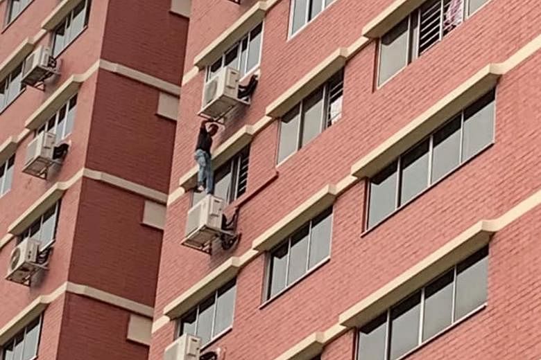 The suspected drug offender climbing down from a 12th-floor flat in Sin Ming Avenue on Thursday. He was later arrested. The Central Narcotics Bureau nabbed 115 suspected drug offenders in an islandwide operation this week.