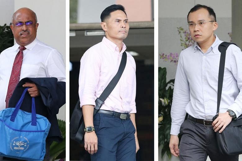 Pathologist George Paul (left), who did the autopsy on Corporal Kok Yuen Chin, testified yesterday at the trial of Singapore Civil Defence Force commanders Nazhan Mohamed Nazi (centre) and Kenneth Chong Chee Boon. Corporal Kok, a full-time national s
