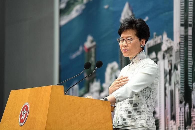 Hong Kong Chief Executive Carrie Lam dodged the question on whether she would step down, except to say she "feels saddened and regretful to have stirred up social conflict".