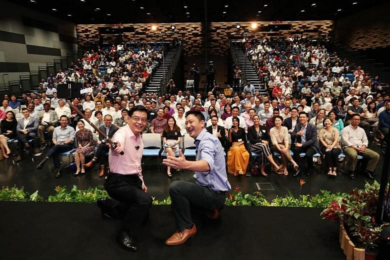 DPM Heng Swee Keat taking a wefie for his maiden Instagram post with Reach-CNA dialogue moderator Steven Chia at SMU's School of Law yesterday. Mr Heng launched his Instagram account at the end of the dialogue.