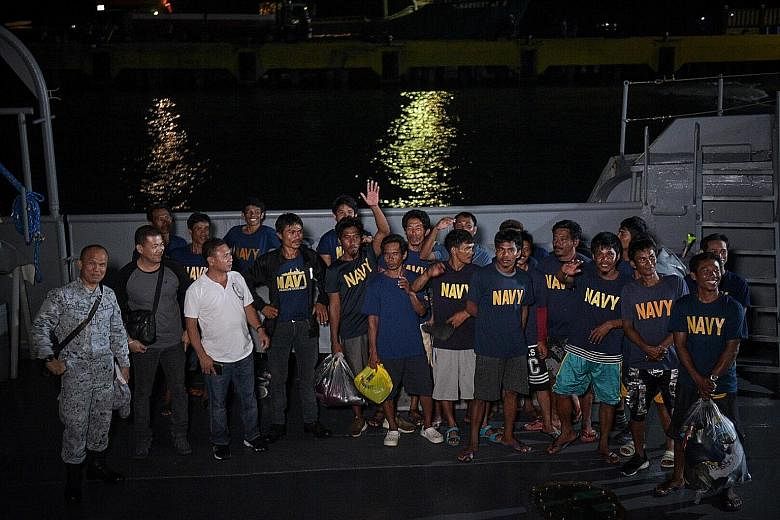 Filipino fishermen returning home on board a Philippine Navy vessel after their outrigger, the Gem-Vir, was allegedly hit by a Chinese vessel in the South China Sea. The 22 fishermen were later rescued by a Vietnamese boat. The Philippines has lodged