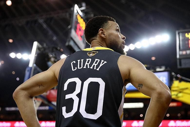 Stephen Curry and his Warriors have lost touch with their working-class fan base in their rush to become a big-money side. PHOTO: AGENCE FRANCE-PRESSE