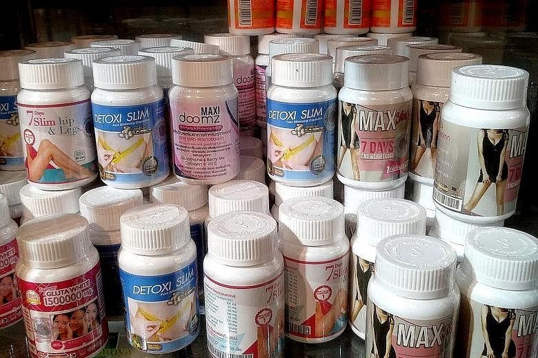 Unregistered slimming pills on sale. One seller admits that what the maids are doing is wrong but says they just want to earn extra money.