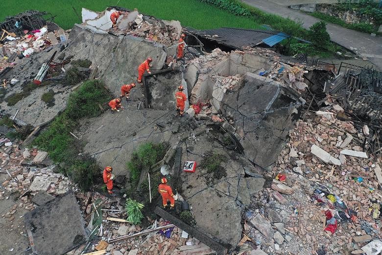 Rescue workers searching for survivors at a collapsed house following an earthquake in Changning county in Yibin, in Sichuan province. PHOTO: REUTERS