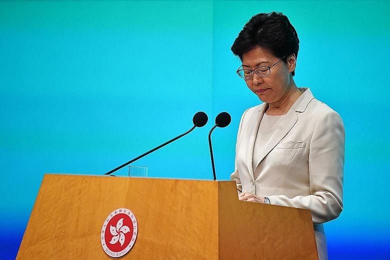 Hong Kong Chief Executive Carrie Lam at a media conference yesterday, where she apologised personally. She said she is committed to serving out her term, and appealed to the people for another chance to lead. ST PHOTO: LIM YAOHUI
