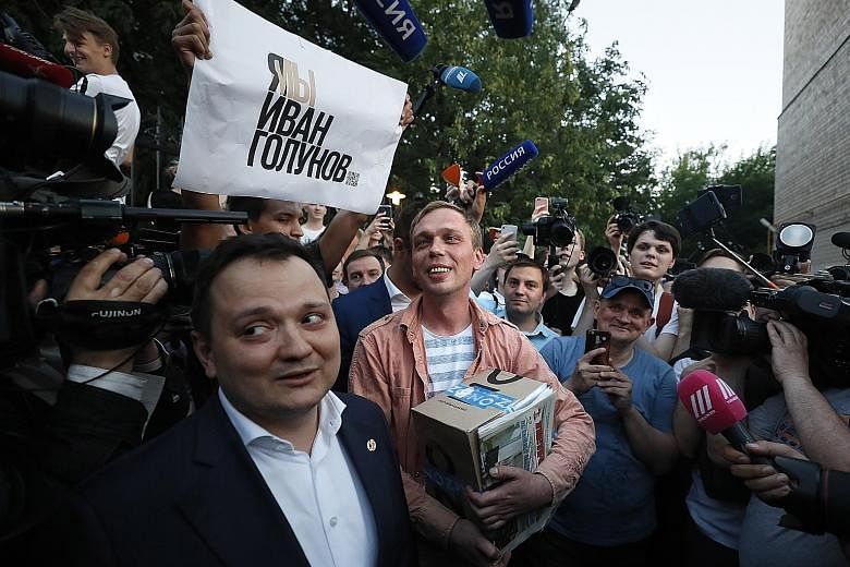Russian journalist Ivan Golunov (centre) leaving the Russian Interior Ministry's Main Investigative Directorate in Moscow last week. He was released after nearly a week under house arrest over drug allegations, following an unprecedented show of prot