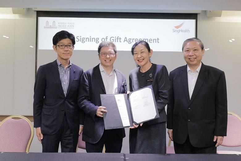 At the gift agreement signing ceremony yesterday were (from far left): Ngee Ann Development's director Tatsuo Yano and executive director Jamie Teo, and SingHealth's group CEO, Professor Ivy Ng, and deputy group CEO, Professor Fong Kok Yong.