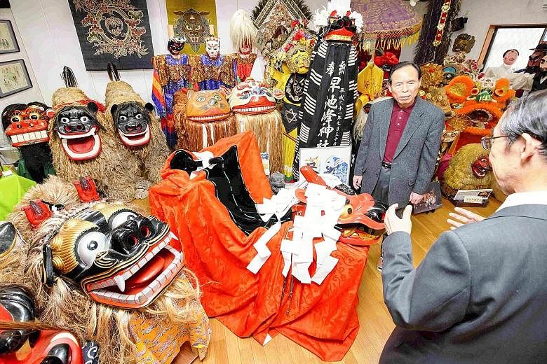 Mr Yuichi Takahashi (right) has more than 2,000 items related to lion dance from across Japan and abroad in his museum in Saitama prefecture.