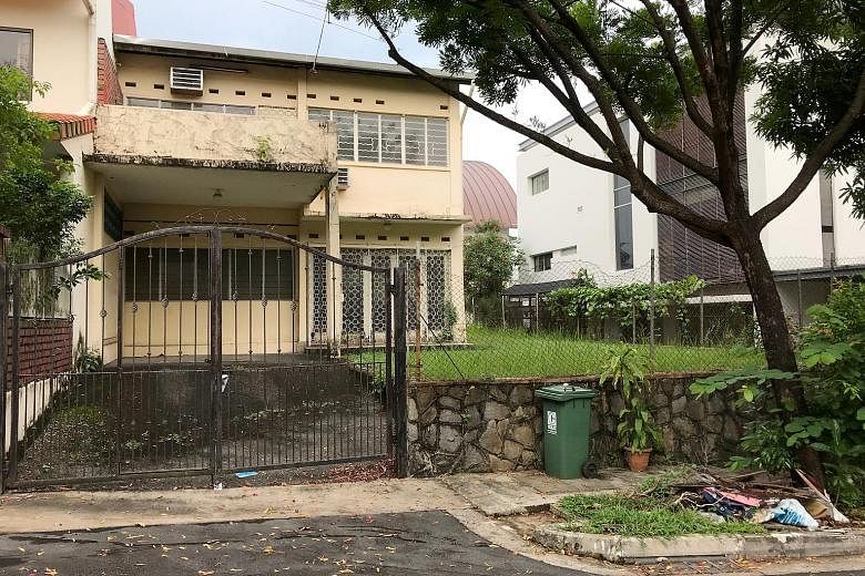 A house in Lorong Pisang Emas, a neighbourhood identified as a dengue cluster previously, that appears to have been left vacant. It was one of at least six vacant houses seen in the estate yesterday - some of which had overgrown weeds and empty flowe