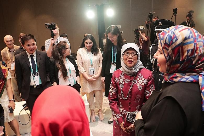 President Halimah Yacob meeting young people working to address challenges of social cohesion in their communities, on the sidelines of the International Conference on Cohesive Societies last night. Around 1,000 academics, government officials and me