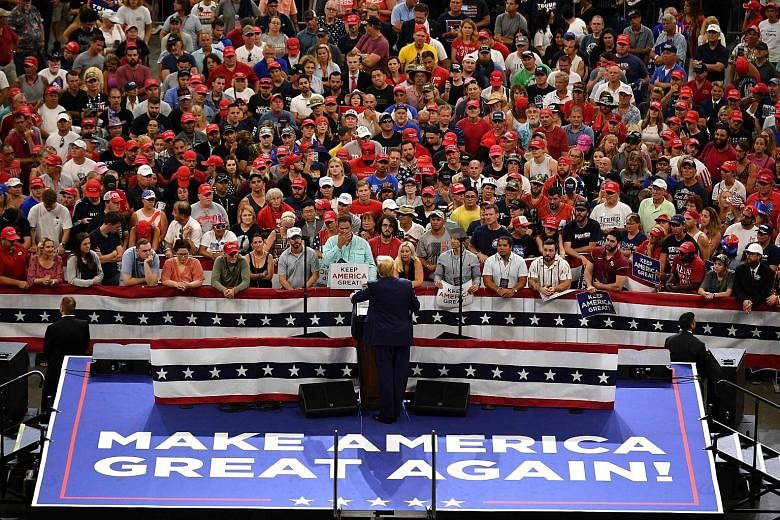 US President Donald Trump speaking during a rally at the Amway Centre in Orlando, Florida, on Tuesday to officially launch his 2020 campaign. The results of an independent poll released on that day showed Mr Trump trailing former Democrat vice-presid