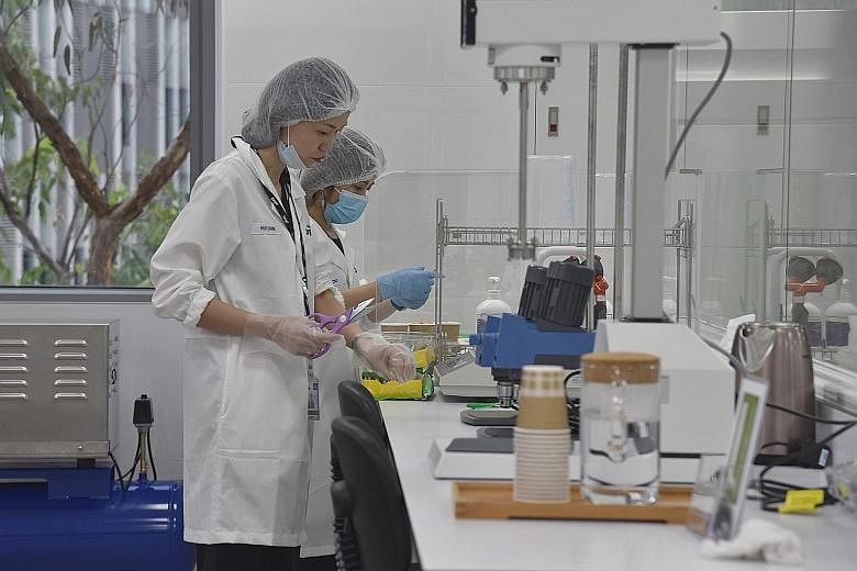 Staff at the Cargill centre preparing samples of food products during a tour of the facility.