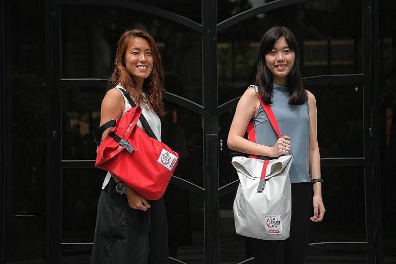 Left: The items in this year's NDP fun packs include reusable items such as bamboo straws that double as clappers and a 750ml water bottle, as well as NDP staples such as face tattoos and a miniature flag. Below: The bags come in red or white and fea