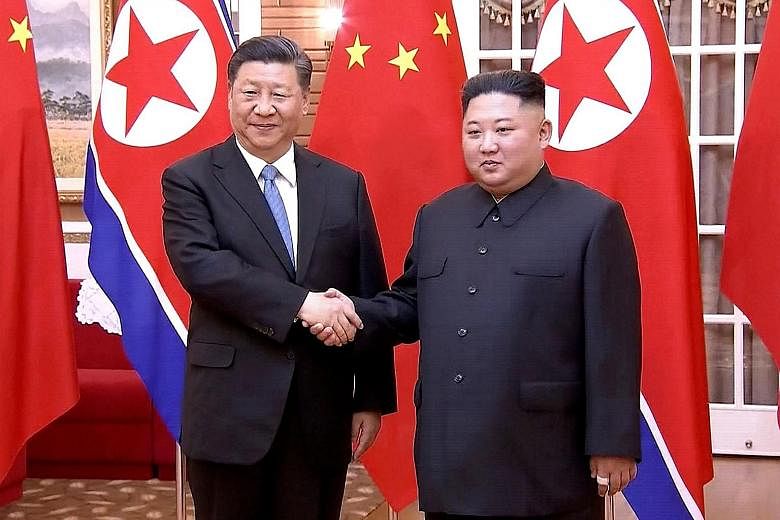 Chinese President Xi Jinping with North Korean leader Kim Jong Un in Pyongyang yesterday, in this screengrab taken off a video released by China's state broadcaster CCTV.