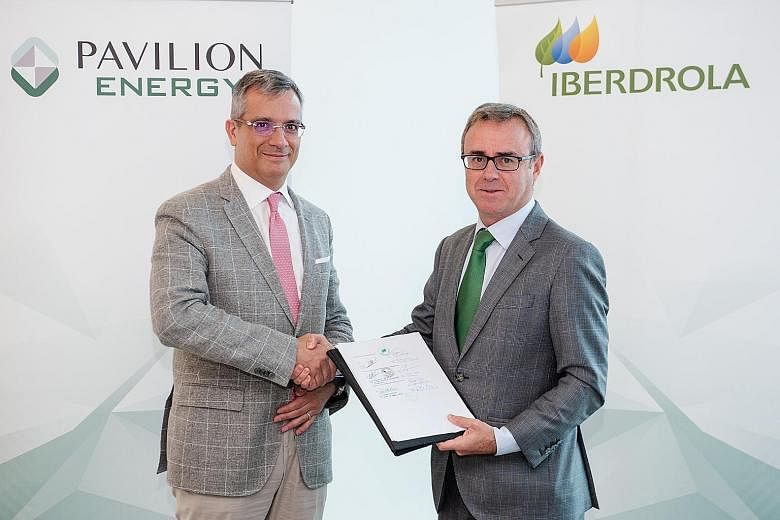 Pavilion Energy group chief executive Frederic Barnaud (far left) and Mr Aitor Moso, chief executive of liberalised business at Iberdrola, after signing the deal. PHOTO: PAVILION ENERGY