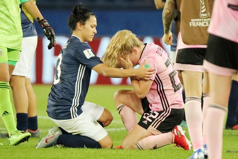Argentina's Eliana Stabile consoling Scotland's Erin Cuthbert after the South Americans snatched a 3-3 draw thanks to a controversial stoppage-time penalty at the Parc des Princes. The result eliminated the Scots.