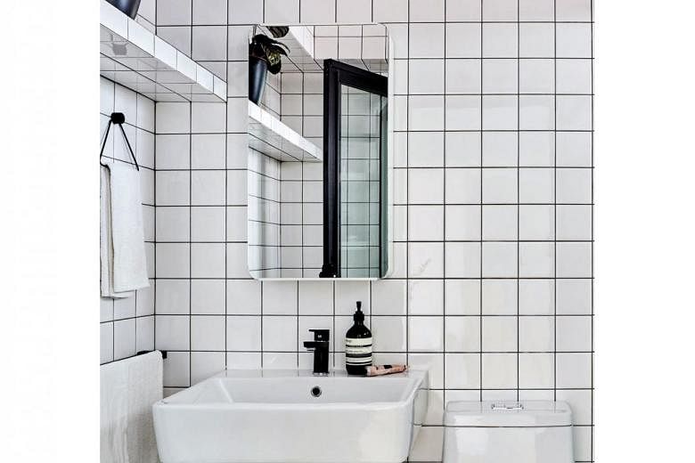 The bathroom is in sync with the master bedroom’s white theme. 
