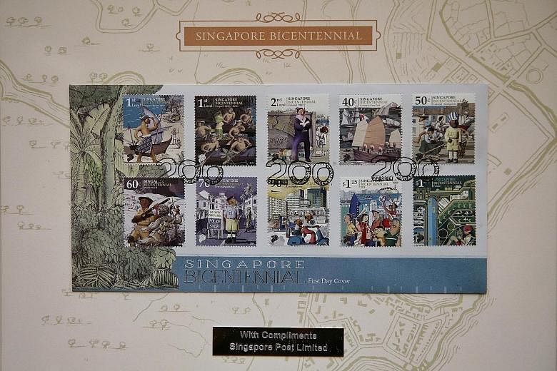 SingPost has launched 10 stamps depicting key milestones in Singapore's 700-year history, including the arrival of the British, independence and a vision of the future. ST PHOTO: KEVIN LIM