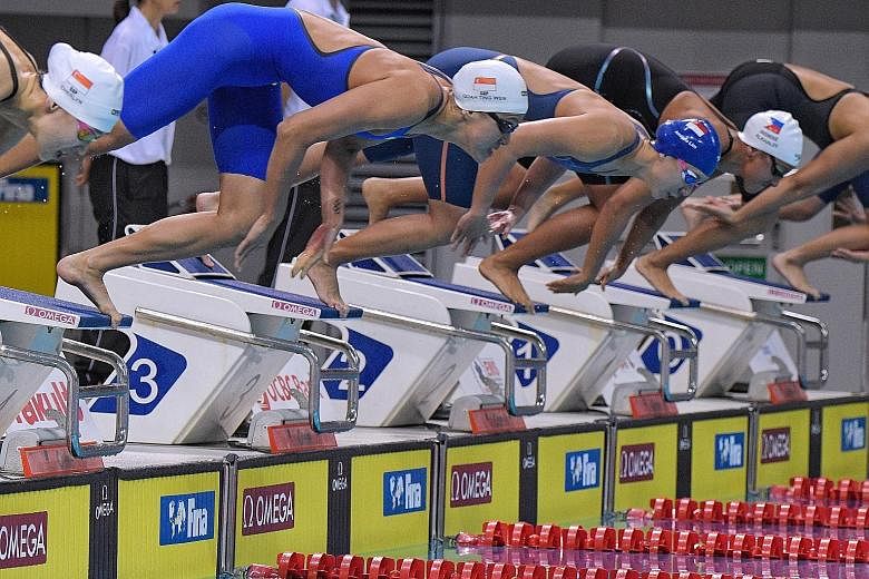 Quah Ting Wen (second from left) on the way to winning the women's 50m freestyle at the Neo Garden 15th Singapore National Swimming Championships. But she did not go under 25sec as she had hoped, managing only 25.26sec at the OCBC Aquatic Centre.