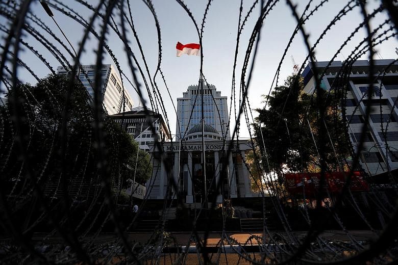 Barbed wires outside Indonesia's Constitutional Court in Jakarta. The court's panel of nine judges is expected to rule on Friday in Mr Prabowo Subianto's suit claiming that the April 17 presidential election was rigged.
